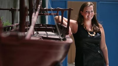 Alexi Trenouth, whose charitable ways began early, stands in the Dubai offices of her employer, Mission to Seafarers.