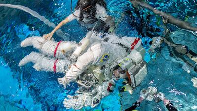 Mr Al Neyadi goes underwater with his EVA suit on for spacewalk training.