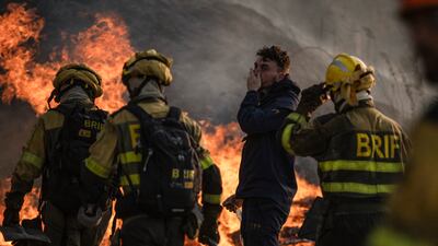 Firefighters try to control the flames during a forest fire in Monterrei, Ourense, Galicia, Spain. EPA