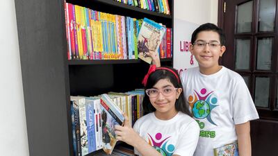 Siblings Aaditya and Aditi Gandhi who set up a library in their home are being including in the Good Deeds book that will be published later this year. Chris Whiteoak The National