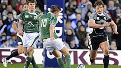 Ireland's Ronan O'Gara strikes a drop goal against Scotland. O'Gara became the tournament's most prolific points scorer at Murrayfield.