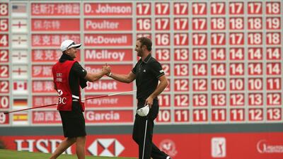 Dustin Johnson, right, celebrates with his brother and caddie Austin Johnson on the 18th green. Andrew Redington / Getty Images