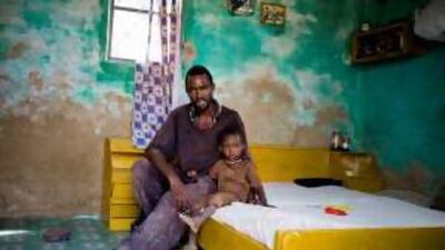 Ousseynou Sy and his son are among thousands of refugees from Mauritanis living in Senegal.