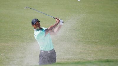Tiger Woods plays a bunker shot on the 16th hole during the third round of the World Golf Championships-Cadillac Championship at Trump National Doral on March 8, 2014 in Doral, Florida. Chris Trotman/Getty Images