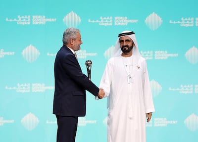 Crown Prince of Dubai and Vice President of the UAE Sheikh Mohammed bin Rashid presents Dr Ferozuddin Feroz, Public Health Minister of Afghanistan, with the best minister award at the World Government Summit in Dubai. Chris Whiteoak / The National