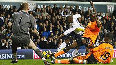 Wigan, who lost to Tottenham on their last visit to White Hart Lane, above, in November, find their orange away kit to be the anti-lucky charm.