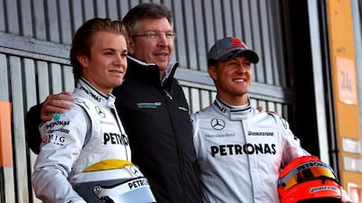 Michael Schumacher retired at the end of the 2006 season, but returned at the start of 2010 to partner Nico Rosberg, left, at Mercedes GP and to work again with team principal Ross Brawn, centre. Vladimir Rys / Getty Images