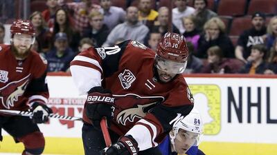 Arizona Coyotes left wing Anthony Duclair shields the puck from St Louis Blues right wing Nail Yakupov during an NHL hockey game. Rick Scuteri / AP Photo
