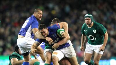 Samoa’s Jack Lam, centre, will be in action this weekend. Peter Muhly / AFP
