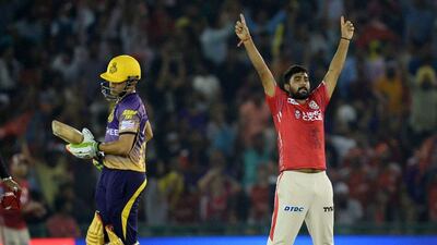 Kings XI Punjab bowler Rahul Tewatia, right, celebrates after he dismissed Kolkata Knight Riders batsman and team captain Gautam Gambhir. Sajjad Hussain / AFP