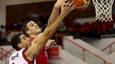 David Miladinovic, right, of Serbia and Omar Farag of Egypt go up for a rebound during their Fiba Under 17 World Championship match at Al Ahli club in Dubai on August 9, 2014. Satish Kumar / The National