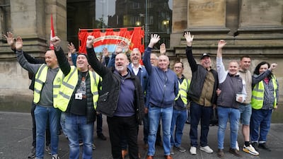Mick Whelan, centre, general secretary of Aslef, joins union members on the picket line outside Newcastle station. PA
