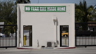 A banner hangs inside a delivery entrance gate at the Huy Fong Foods Sriracha Hot Chili Sauce factory. David McNew / Getty Images / AFP