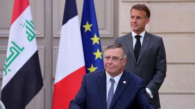 France's President Emmanuel Macron, right, and TotalEnergies chairman and chief executive Patrick Pouyanne at the Elysee Palace in Paris on September 14. AFP