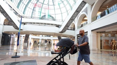 Saeed Saeed tests the Dubai Mallathon with his nine-month-old son in tow. Chris Whiteoak / The National