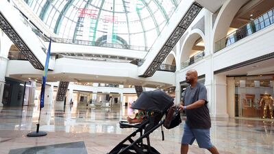 Saeed Saeed tests the Dubai Mallathon with his nine-month-old son in tow. Chris Whiteoak / The National