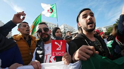 A man holds a sign reading" No vote", during a protest rejecting the presidential election in Algiers, Algeria December 11, 2019. Reuters