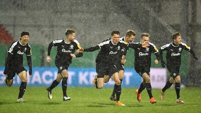 Holstein Kiel celebrate after winning the penalty shootout. Getty