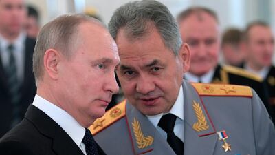 Russian President Vladimir Putin, left, with defence minister Sergei Shoigu at an awards ceremony for troops who fought in Syria. Alexei Druzhinin / Kremlin pool via AP