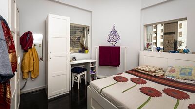 Ms Bhatia's queen-sized bed with a vanity table and wardrobe