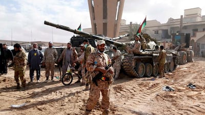 Fighters of Libyan forces allied with the UN-backed government gather as they advance against ISIL. Ismail Zitouny / Reuters