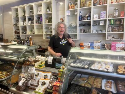 Pan, who runs the Greek deli Menoo, says card payments have made running his business more expensive. Lemma Shehadi / The National