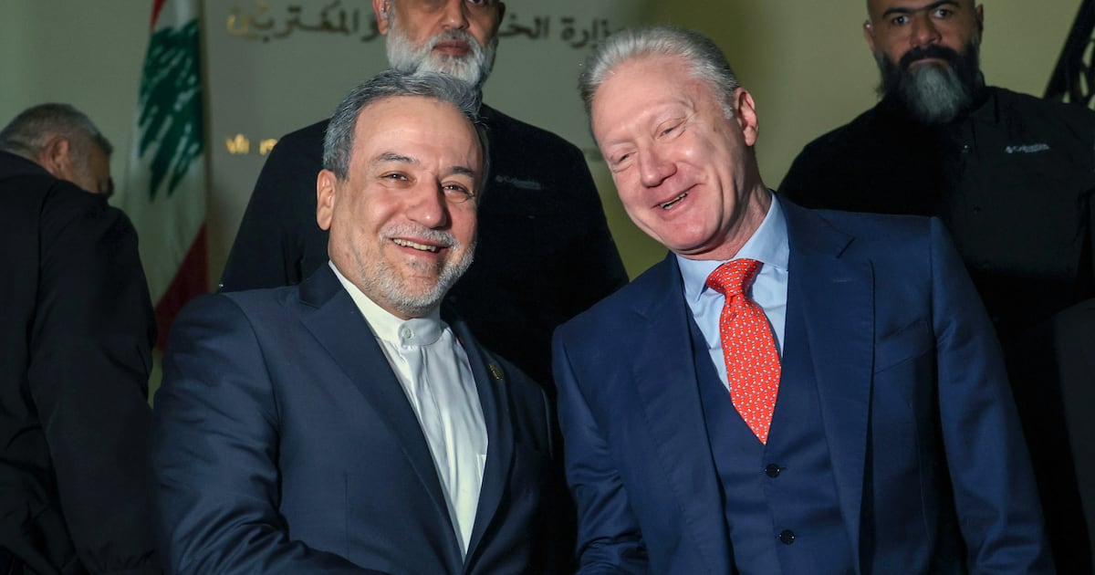 Photo: Thenationalnews Abbas Araghchi, left, Iranian Foreign Minister, shakes hands with his Lebanese counterpart, Youssef Raggi, at the Foreign