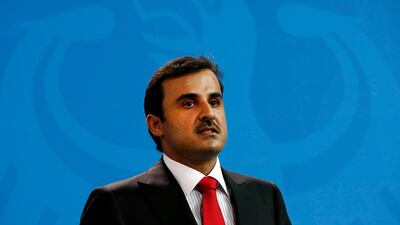 The Emir of Qatar, Sheikh Tamim, speaks at a press conference with Angela Merkel. EPA/Felipe Trueba