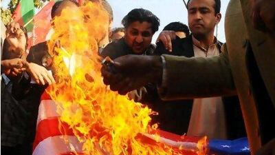 Pakistanis set fire to the US flag in a protest in Lahore against a US legislative effort supporting independence for Baluchistan, province in south-west of the country.