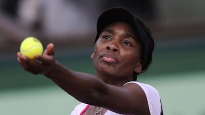 Venus Williams serves at Roland Garros