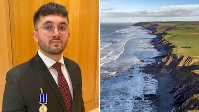 Zaid Anfoka and the scene of the rescue, Northcott Mouth, in Cornwall. Thomas Harding / The National / Getty Images