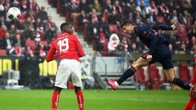 Robert Lewandowski heads home Bayern Munich's first goal against Mainz. Getty