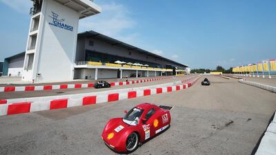 The EnduroKiwi, a battery electric UrbanConcept vehicle racing for team EnduroKiwis from University of Canterbury, New Zealand on the track at the Changi Exhibition Centre. Joseph Nair for Shell