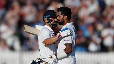 India's KL Rahul celebrates his century with captain Virat Kohli.