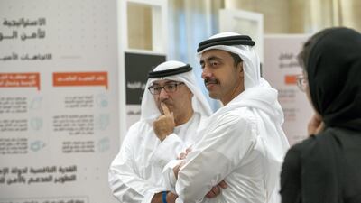 Sheikh Abdullah bin Zayed, Minister of Foreign Affairs and International Co-operation, and Abdulrahman Al Owais, Minister of Health and Prevention, listen to a Capstone project presentation by a graduate.
