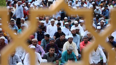 Muslim men gather outside a mosque in Muscat on the first day of Eid Al Adha. AFP
