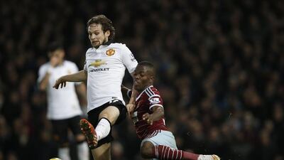 West Ham United striker Enner Valencia, right, vies with Manchester United midfielder Daley Blind on Sunday during their Premier League match at Upton Park. Adrian Dennis / AFP