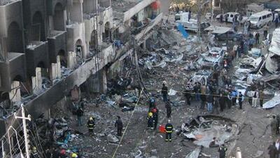 Iraqi security forces inspect a crater caused by a car bomb in the Karrada neighbourhood in Baghdad.