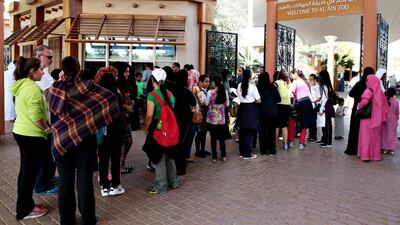 Participants wait in line ahead of the EnviroWalk at Al Ain Zoo at the weekend. Christopher Pike / The National