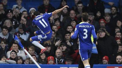 Pedro kicks the corner flag in celebration after scoring the opening goal. Tony O’Brien / Reuters
