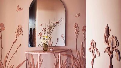 The hallway with Wedgewood-inspired floral work.