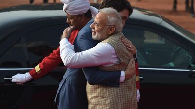 India's Prime Minister Narendra Modi embraces Canada's Prime Minister Justin Trudeau upon the latter's arrival to the Presidential Palace in New Delhi on February 23, 2018. Mr Trudeau and his family are on a week-long official trip to India. Prakash Singh / AFP