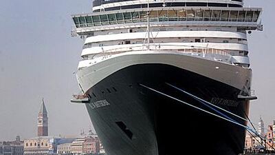 A cruise liner sits in port in Venice. Residents are concerned that pollution and more tourists are threatening the city's foundations.