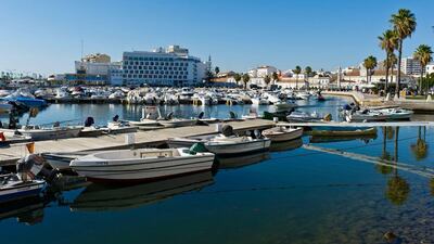 The Faro marina, with the Eva hotel visible in the background. The city’s walled old town is situated near the marina. Alamy