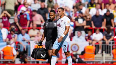 Aston Villa defender Diego Carlos limps off the pitch after picking up an injury early in the game. AP