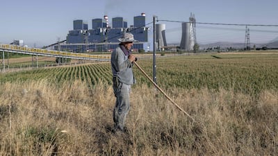 Turkish farmer Yusuf Avci works his field close to the Afsin power plant in Kahramanmaras province