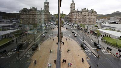 Pedestrians walk along Princes Street, the main shopping street in Edinburgh. Suzanne Plunkett / Reuters