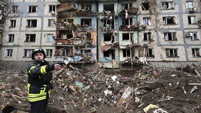 Ukrainian rescuers at the scene of a missile strike near a residential building, in Zaporizhzhia. EPA