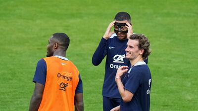 France's Antoine Griezmann, right, with Kylian Mbappe, and Marcus Thuram during a training session. AP