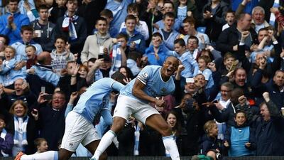 Manchester City captain Vincent Kompany celebrates after scoring against West Ham United during their Premier League title-earning win on Sunday. Darren Staples / Reuters
